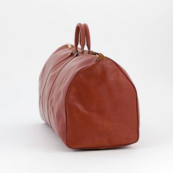 LOUIS VUITTON, a brick red epi weekend bag, "Keepall 60".