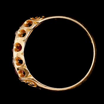 RING, 18 k guld, England 1904, med röda stenar och rosenslipade diamanter. Vikt ca 3 gram.