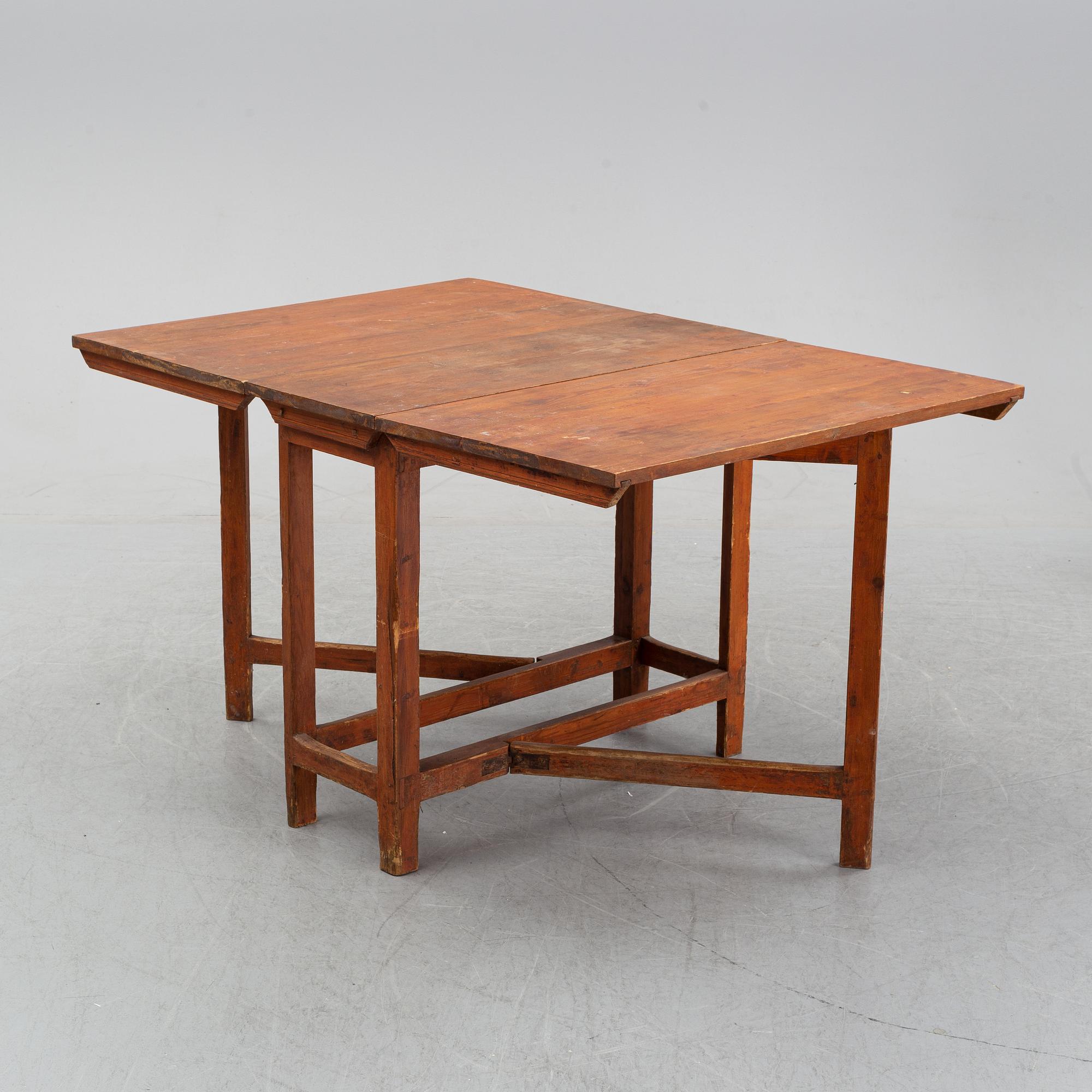 A pine gate leg table, 19th Century.