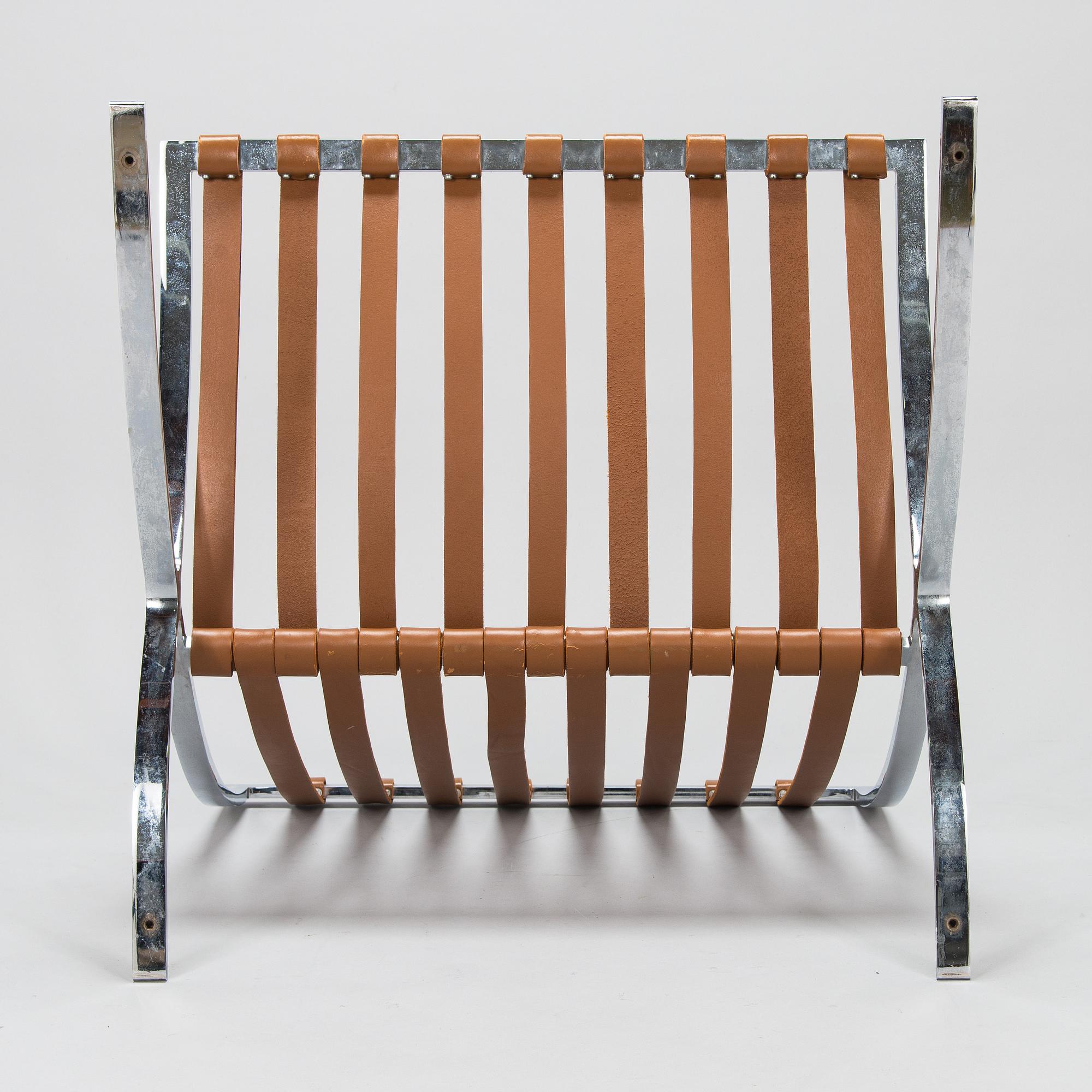 A Ludwig Mies van der Rohe "Barcelona" chair.