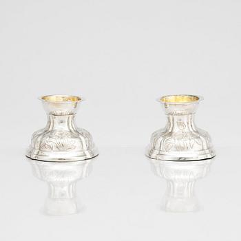 A pair of German rococo parcel-gilt silver salt-cellars, 18th century.