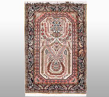 A rug, silk Quum, ca 129 x 80 cm.