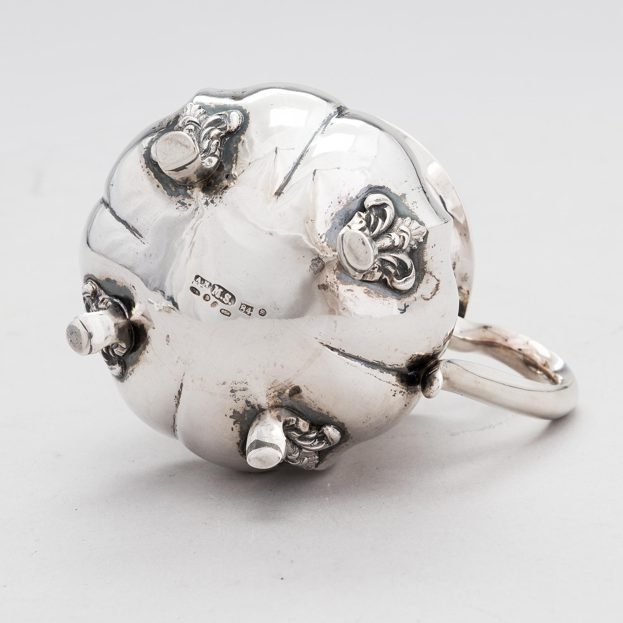 A Russian silver milk jug, and a silver fork, knife and spoon, Saint Petersburg 19th century.