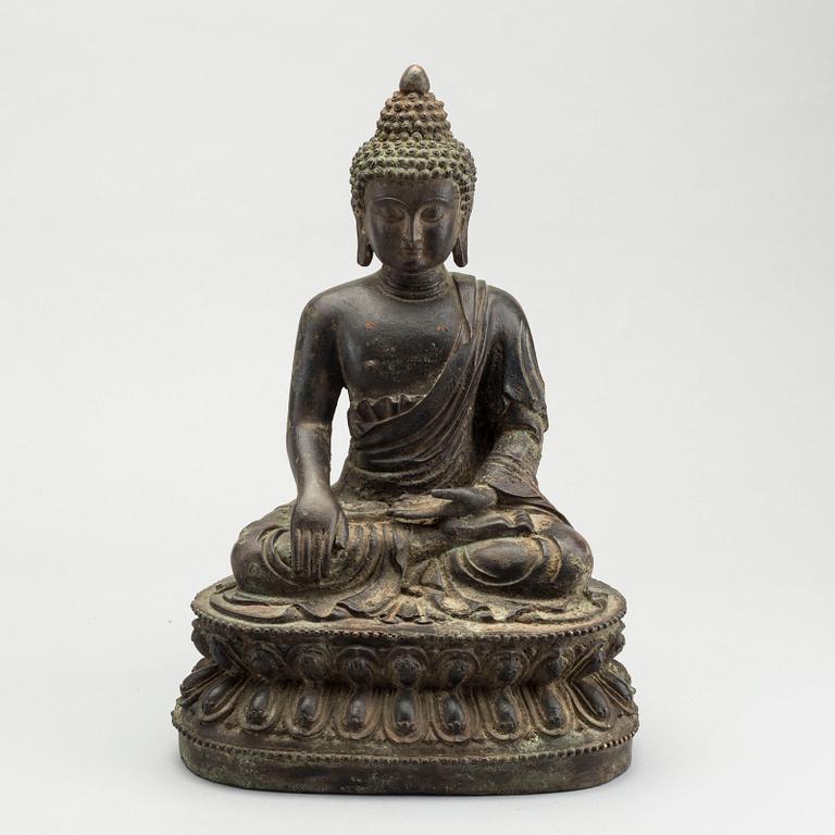 A bronze seated figure of Shakayamuni buddha, Mingtype.