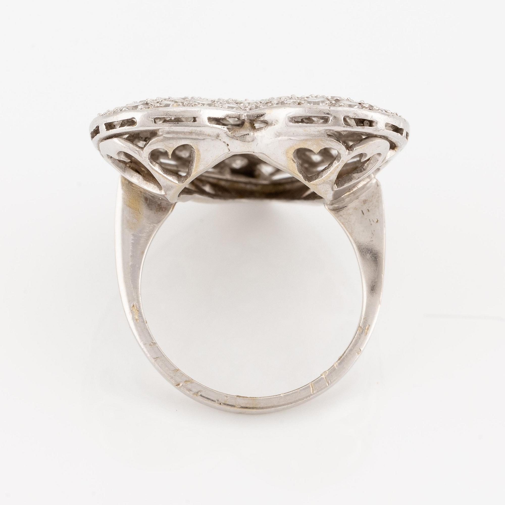 An 18K white gold ring set with eight-cut diamonds.
