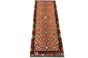 A Kilim runner carpet, c. 384 x 83 cm.