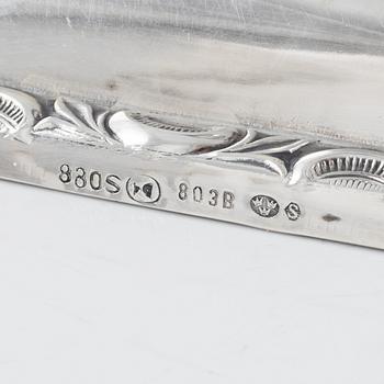 A Swedish Silver Ladle, mark of Adolf Öström, Piteå 1887 and a pair of Silver Candlesticks.