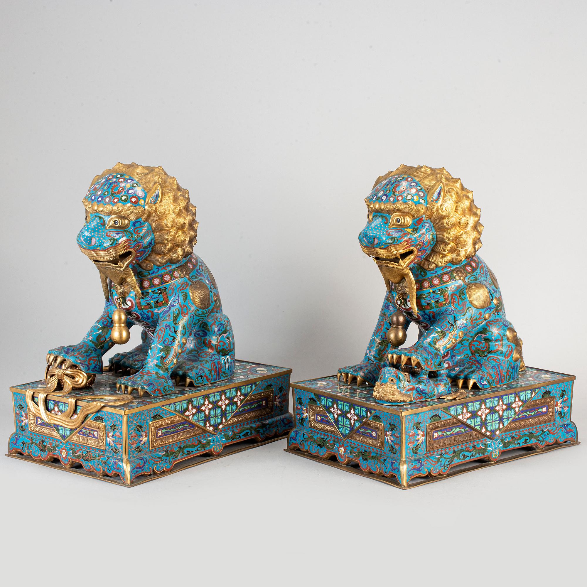 A pair of cloisonne buddhist lions, China, modern manufactory.