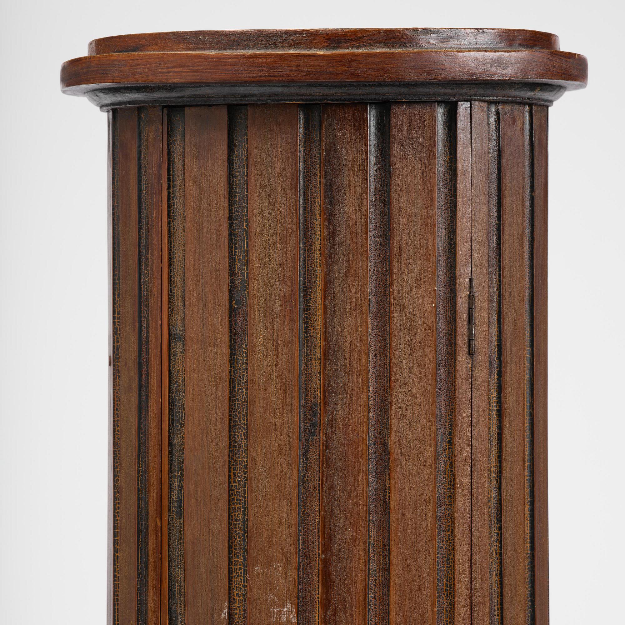 A Swedish Empire column-shaped cabinet, first part 19th century.