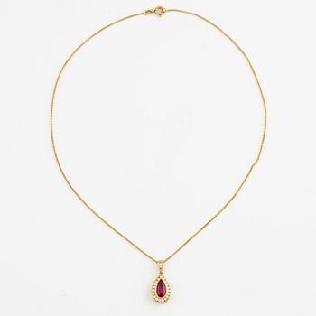 Pendant with chain, 18K gold set with a pink and red toned drop-shaped tourmaline and brilliant-cut diamonds.