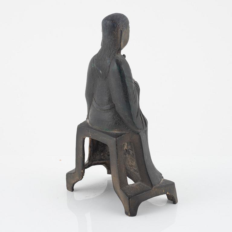 A bronze sculpture of a seated deity, Ming style, probably 20th Century.