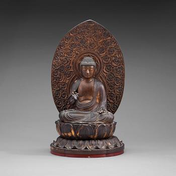 221. A Japanese wood and lacquer figure of buddha, Meiji (1868-1912).