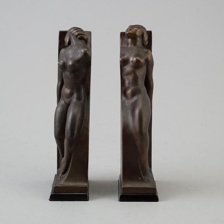 A pair of circa 1920 bronze book ends by Axel Gute, signed.