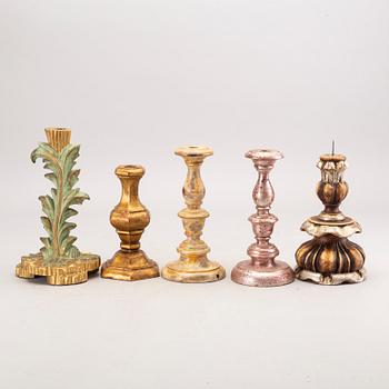 A set of 11 mid 20th century wooden candle sticks(table lamps) from Paoletti, Firenze Italy.