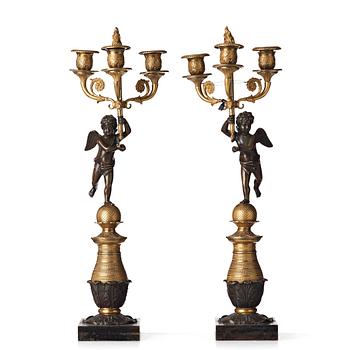 94. A pair of French Empire three-light candelabra, beginning of the 19th century.