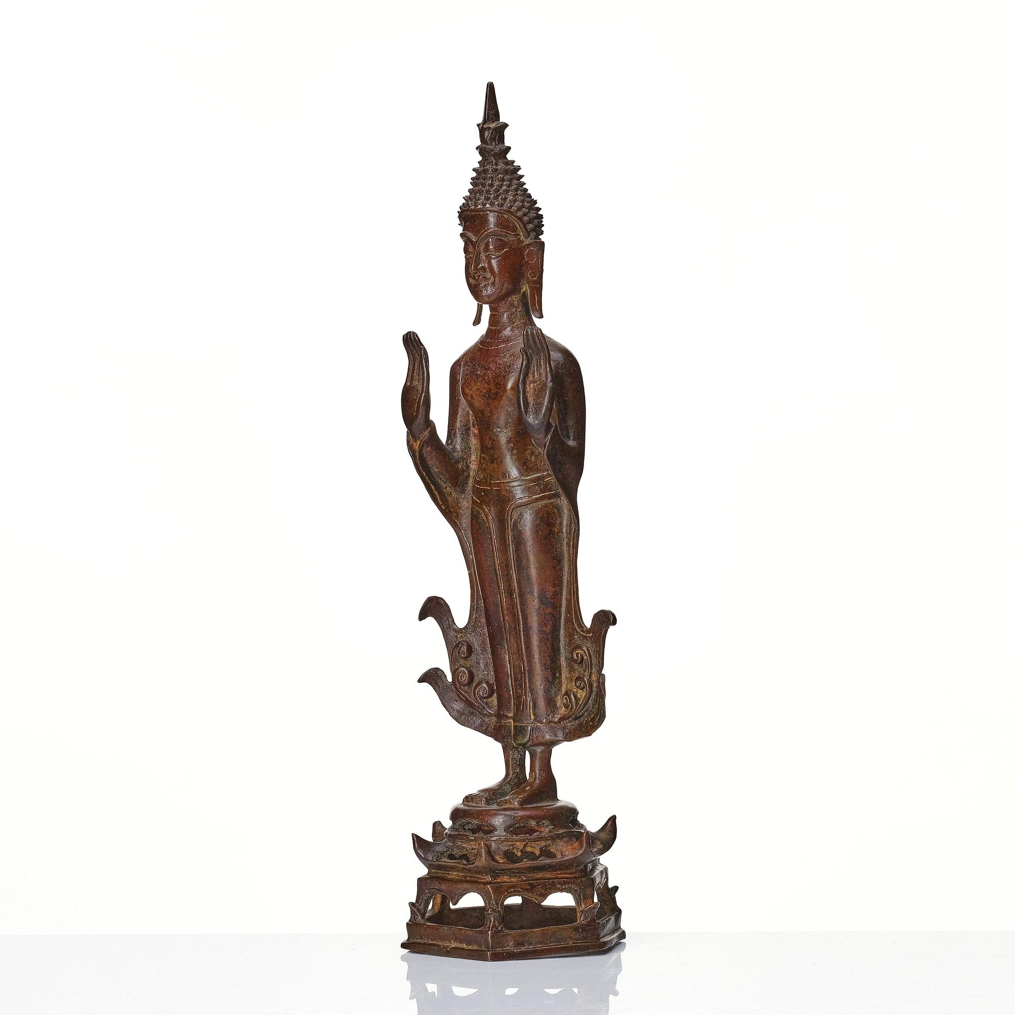 A standing sculpture of buddha, Laos, 18th Century.