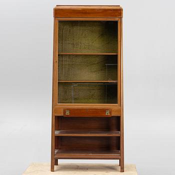 A display cabinet, early 20th Century.