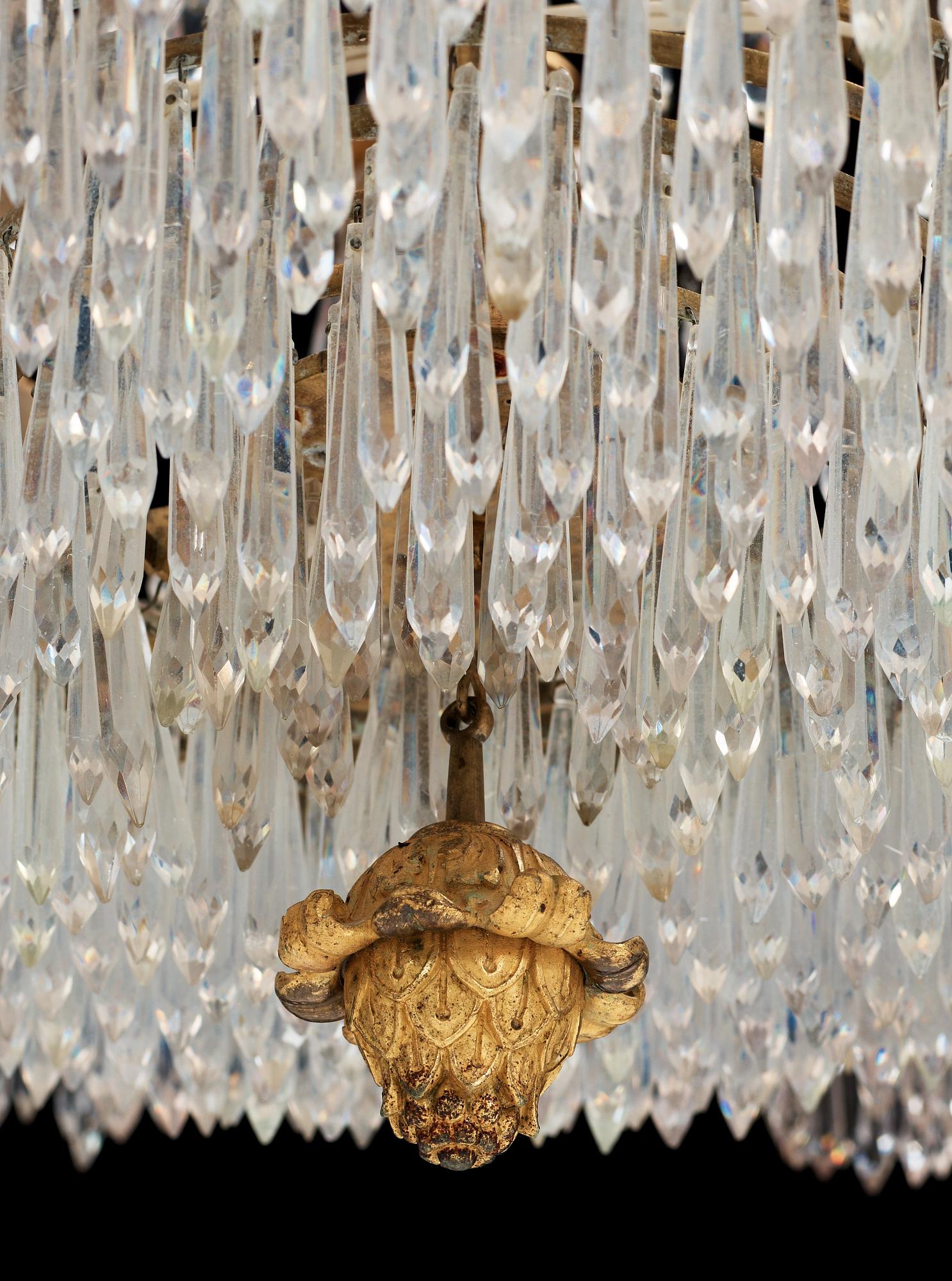 An Empire first half 19th century eighteen-light gilt bronze chandelier.
