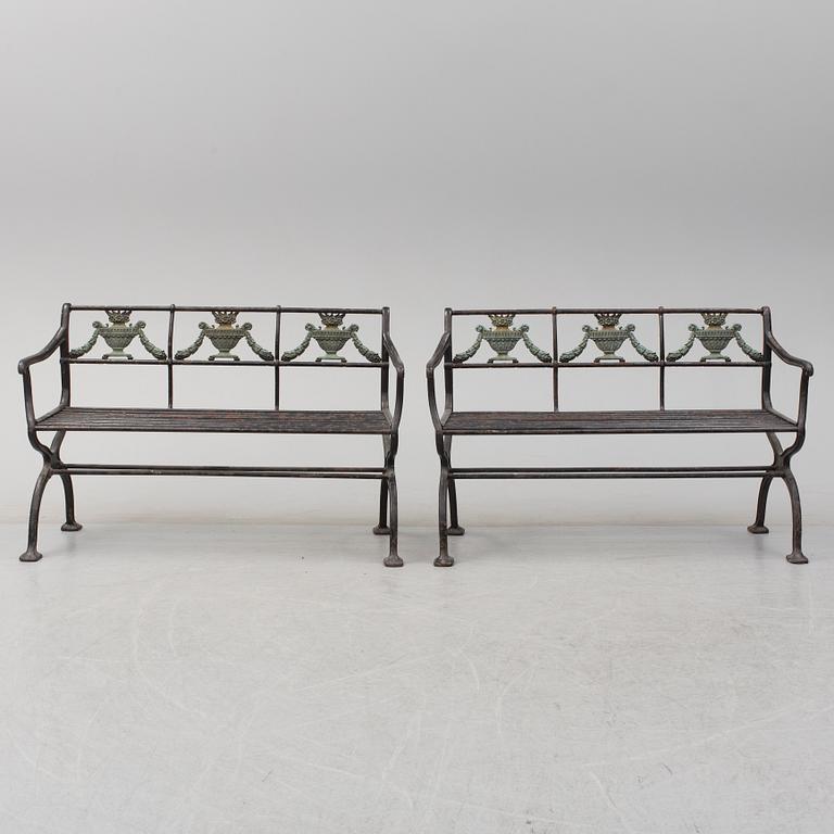 GARDEN SOFAS, a pair, cast iron, empire style, late 19th century.