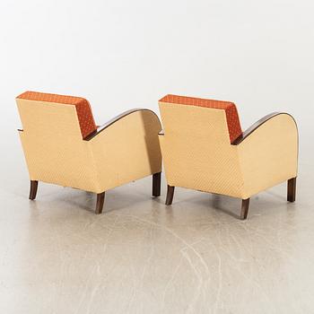 A pair of 1930/40:s Art Deco easy chairs.