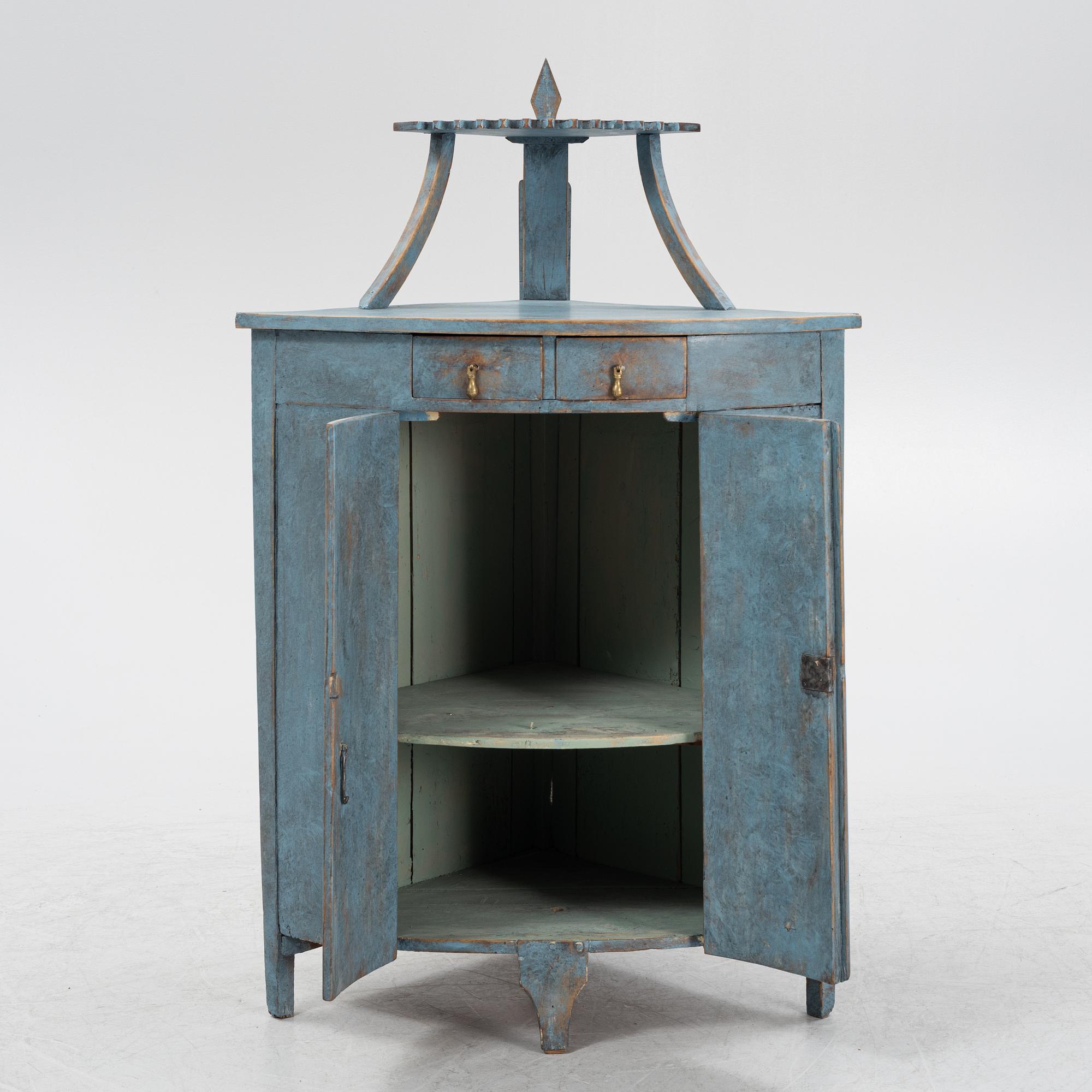 A painted corner cabinet, late 19th century.