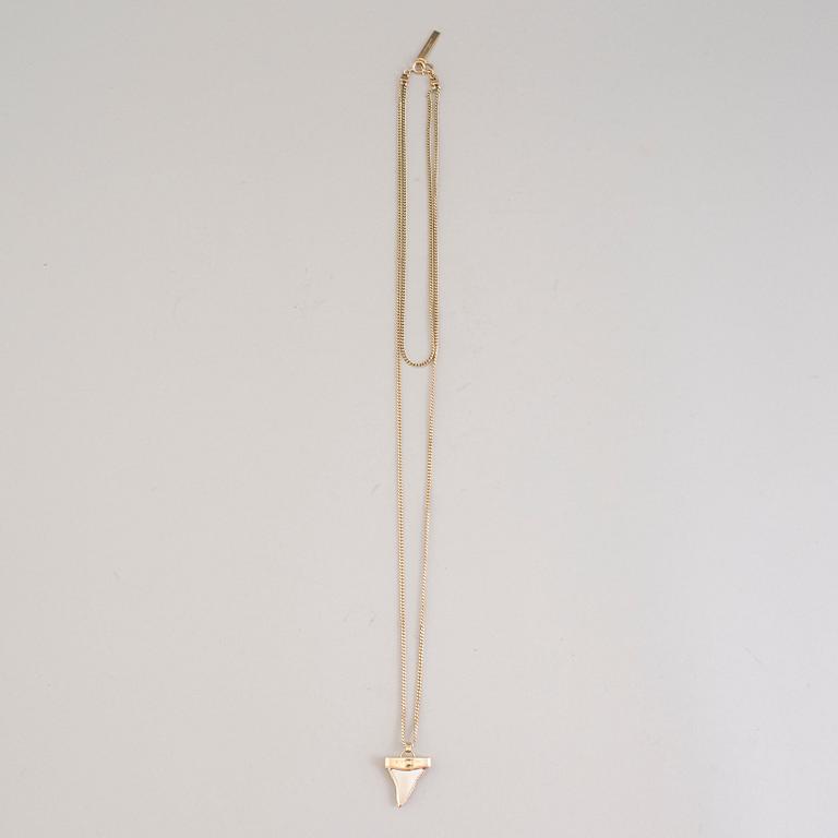 a Givenchy 'Shark tooth' necklace.