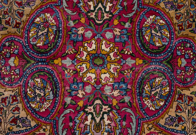 A semi-antique Kirman carpet, south Persia, c. 440 x 279 cm.