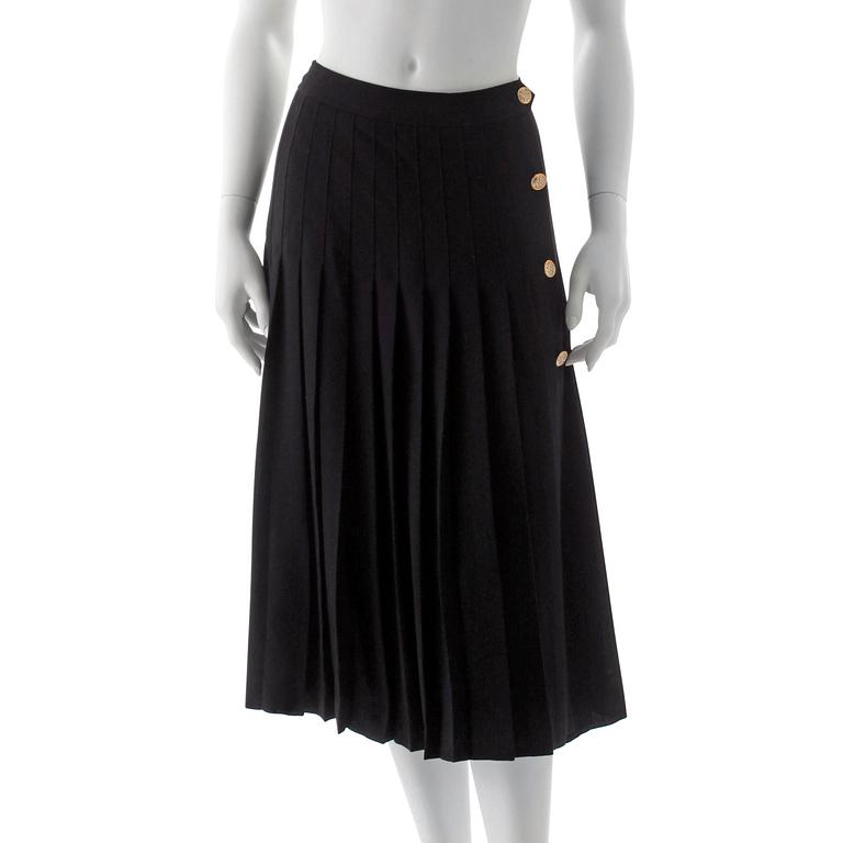 CÉLINE, a black pleated wool skirt.