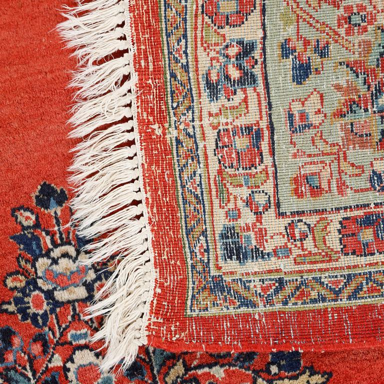 A Kirman rug, old, 218 x 210 cm.