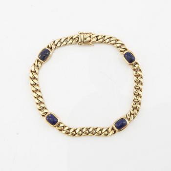 Bracelet curb chain 14K gold with Lapis Lazuli.