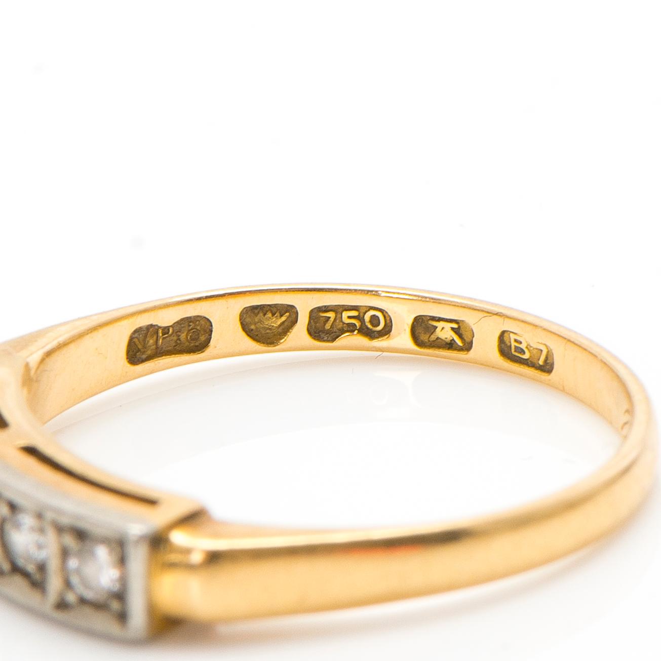 An 18K gold ring with diamonds ca. 0.22 ct in total. Päiviö Veikko, Turku 1955.
