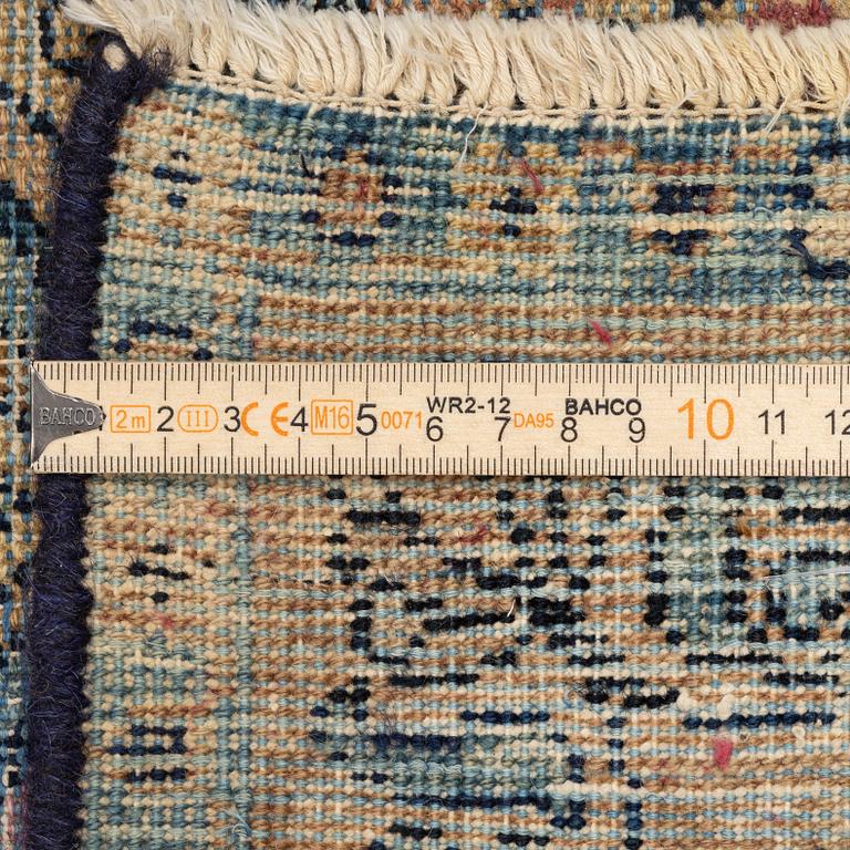 A semi-antique Kerman carpet, c. 325 x 203 cm.