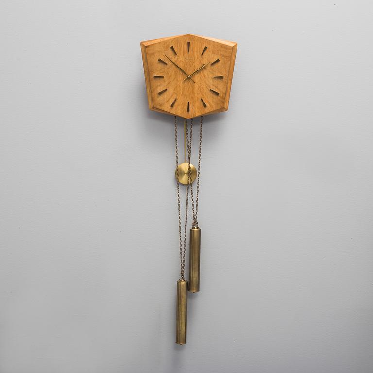 An oak veneered wall clock from the 1960s.