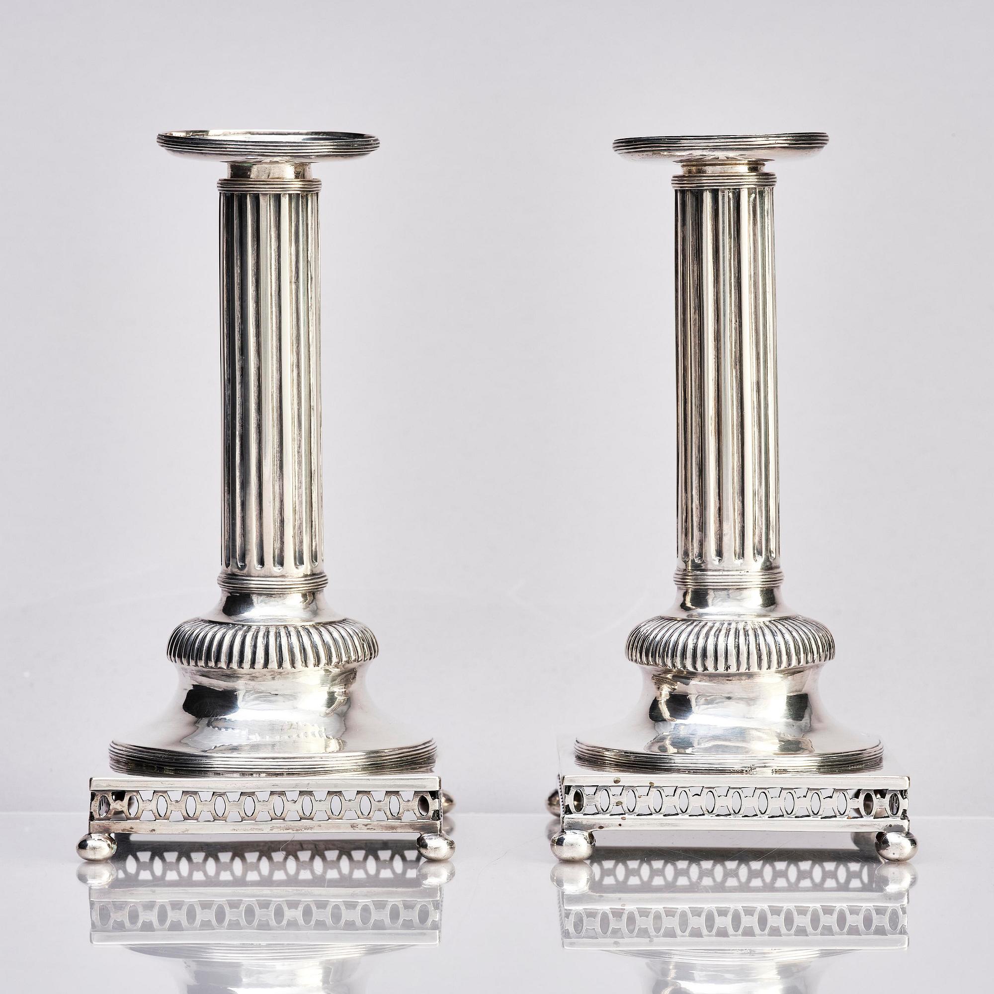 A pair of Swedish 18th century Gustavian silver candlesticks, marks of Arvid Floberg, Stockholm 1799.