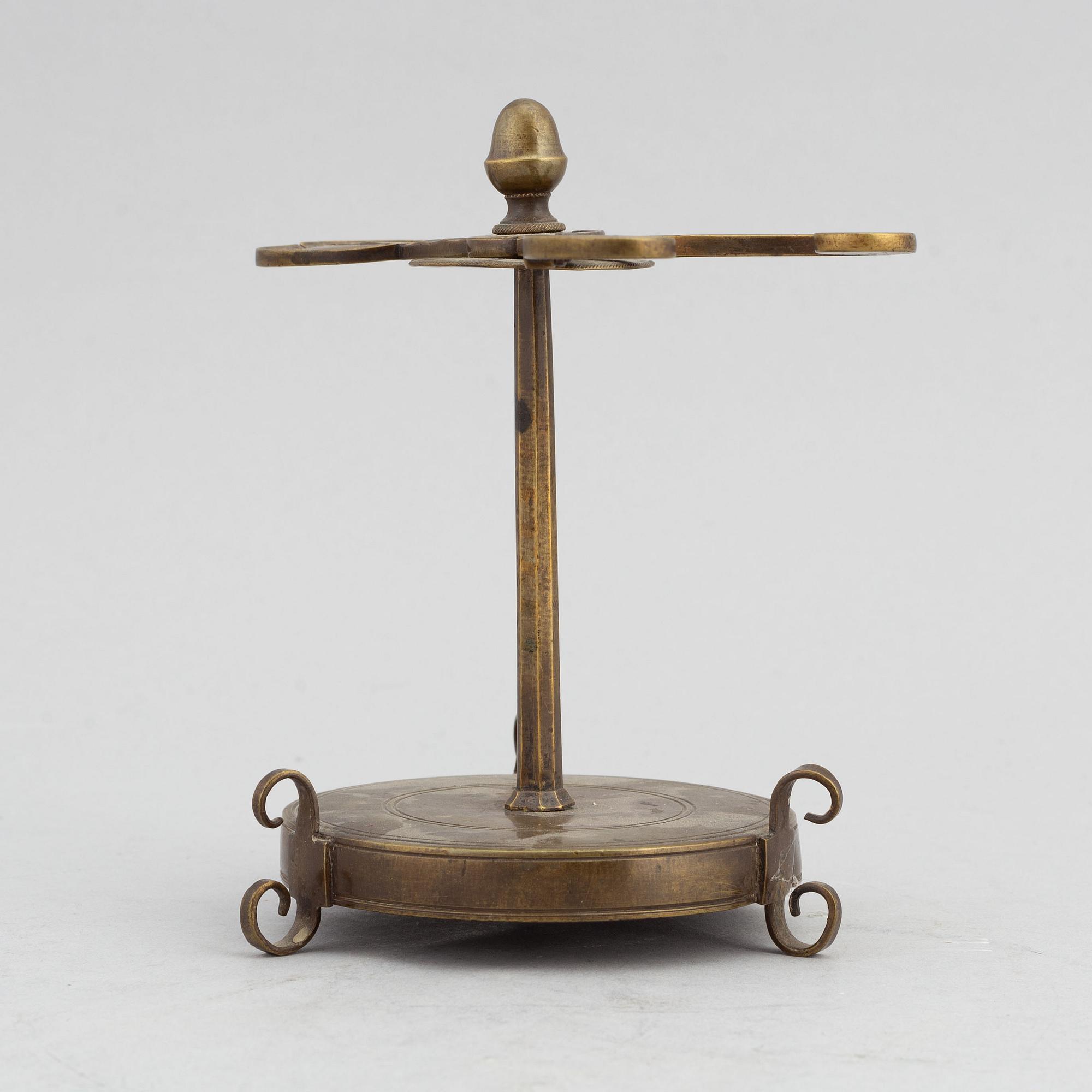 A 18th Century brass candle holder.
