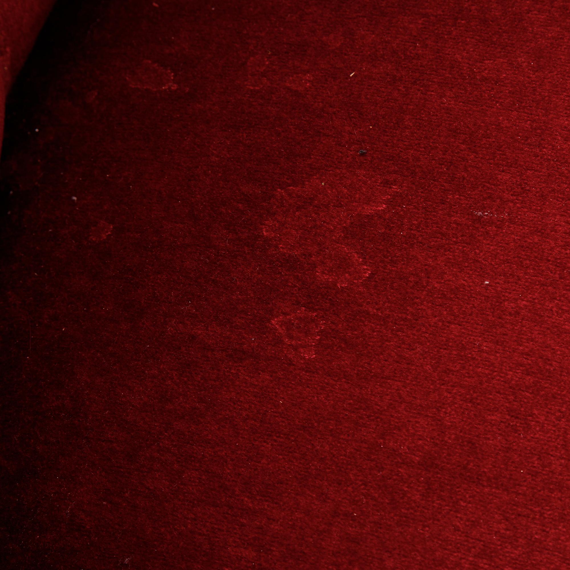 A first half of the 20th Century sofa with velvet upholstery.