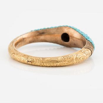 An 18K gold bracelet with turquoises and an old-cut diamond.