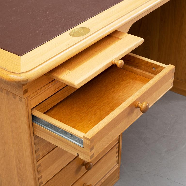 An oak writing desk by Finn N Hansen. End of the 20th Century.