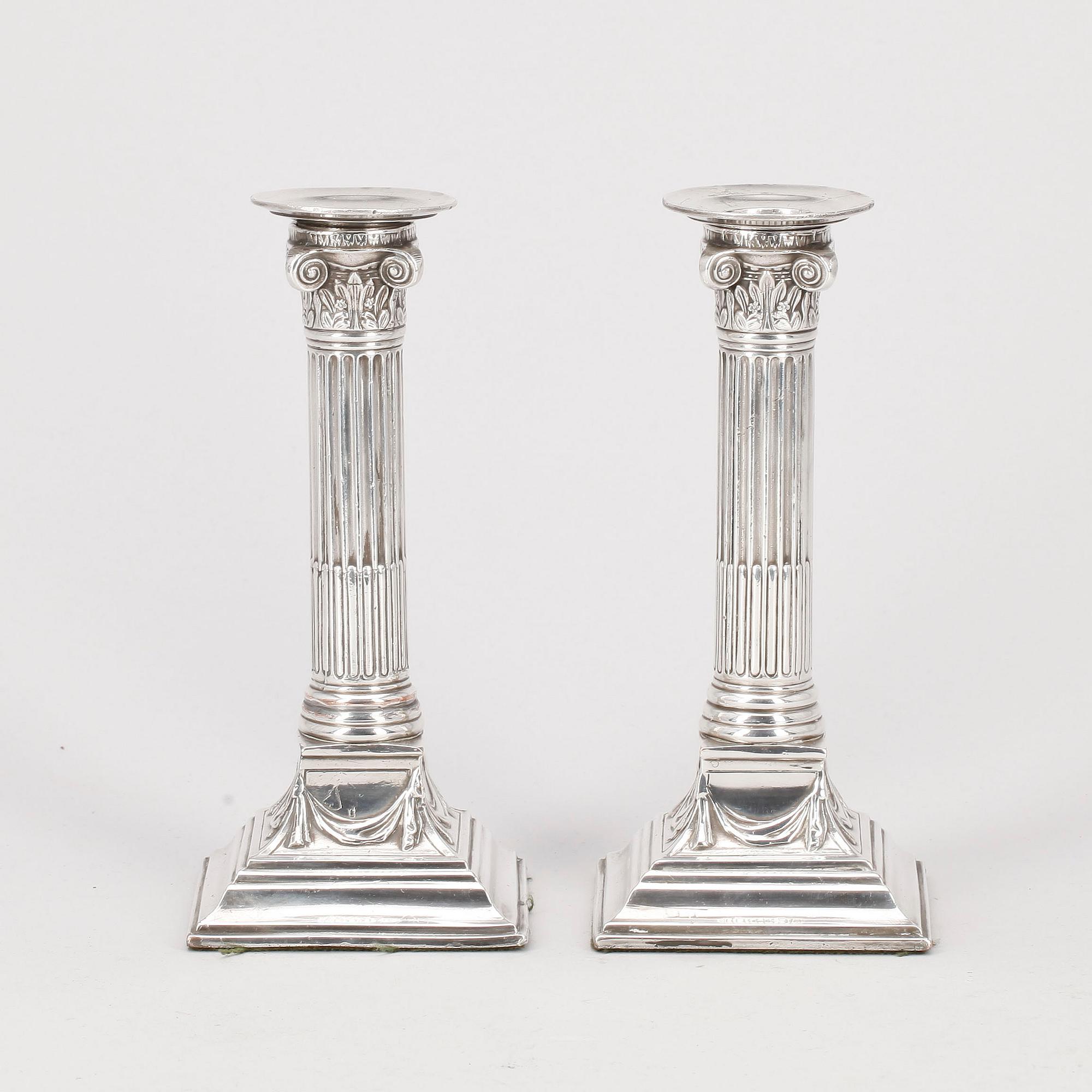 LJUSSTAKAR, ett par, nysilver, 1800-tal.