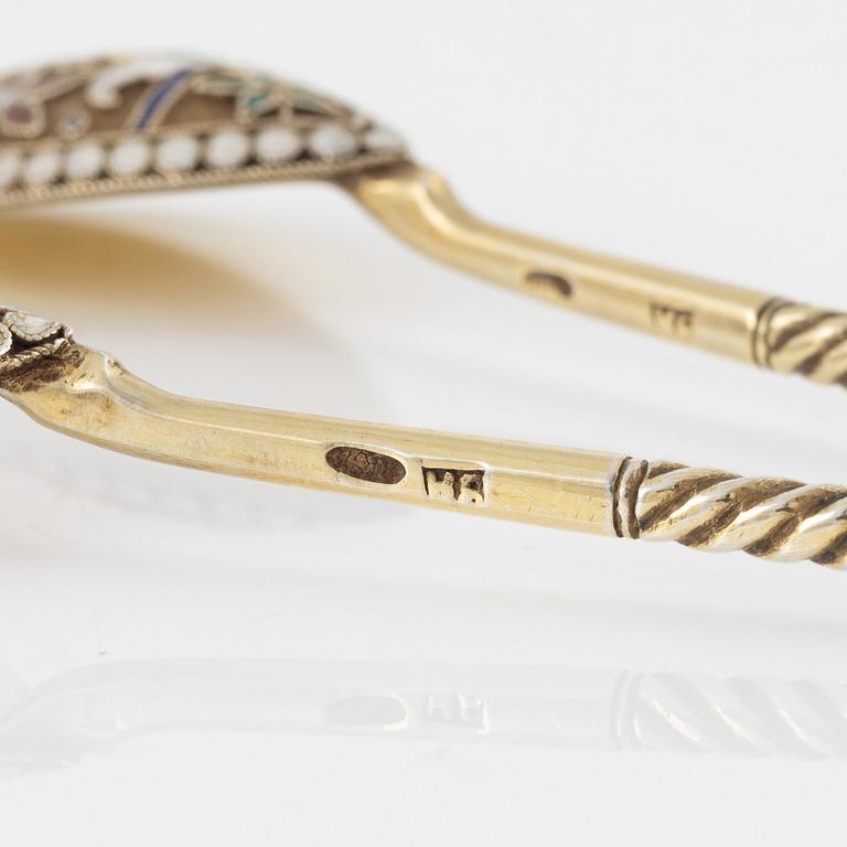 Eight Russian gilded silver and enamel spoons, Moscow, 1896-1908.