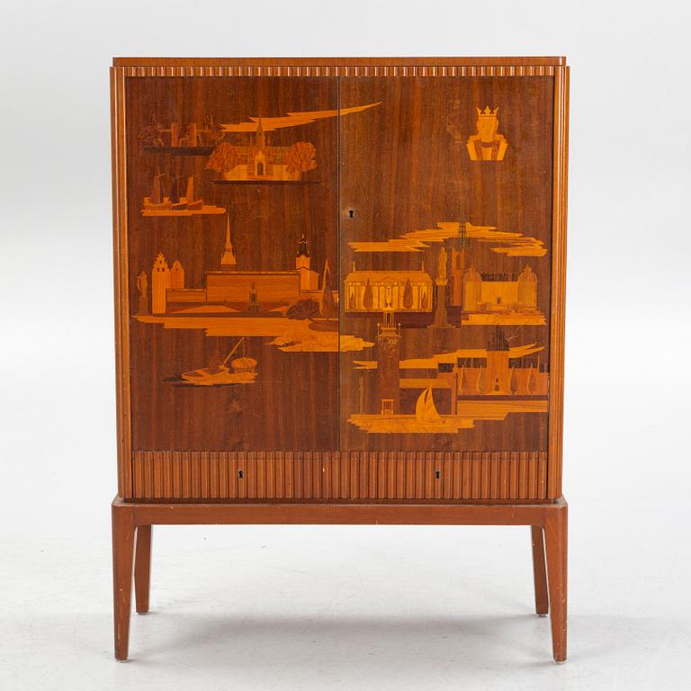 Erik Mattsson, skåp, "Stockholm" utfört av  Birger Ekman, Mjölby Intarsia för AB Harry Carlsson Stockholm, 1940-tal.