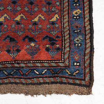 A runner carpet, antique Kurdish possibly, c. 280 x 112 cm.