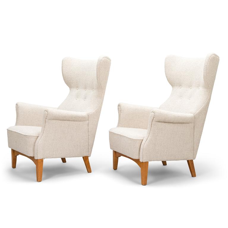 A 1950's pair of 'Inkeri' armchairs manufactured by Asko Finland after a Danish model.