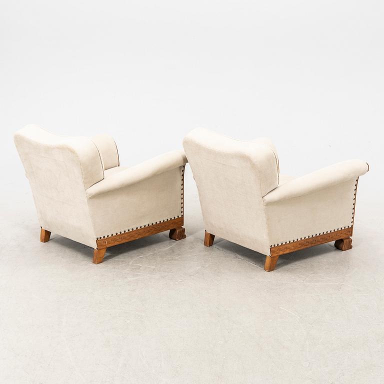 A pair of easy chairs from the first half of the 20th century.