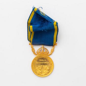 Medalj, 23K guld "för nit och redlighet i rikets tjänst".