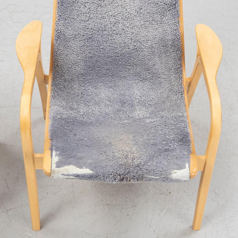 Yngve Ekström, A 'Lamino' easy chair with stool, Swedese, dated -07.