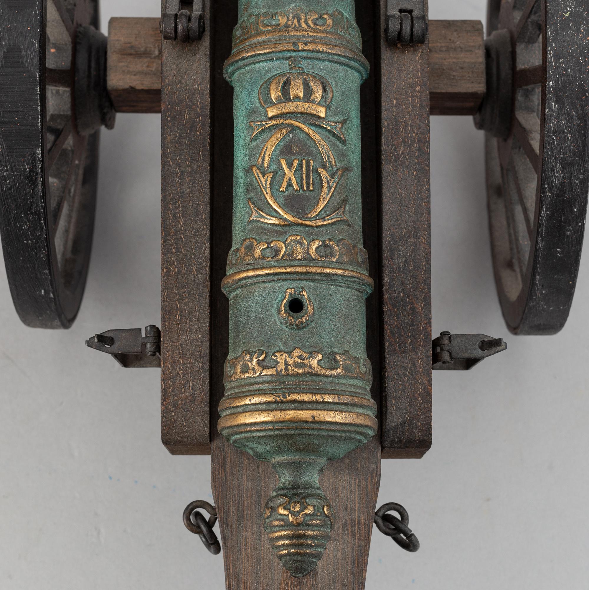 A copy of a field canon with monogram of king  Karl XII produced by Svensk Metallkonst, Carlscrona in late 20th century.