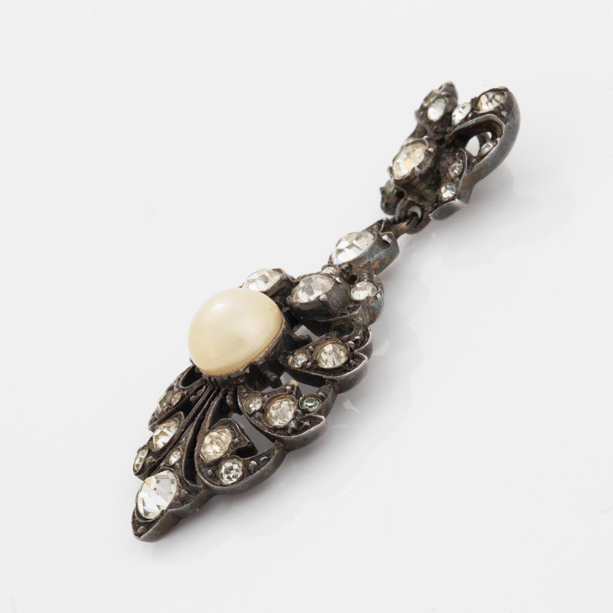 Earrings, brooch, and pendant silver with paste.