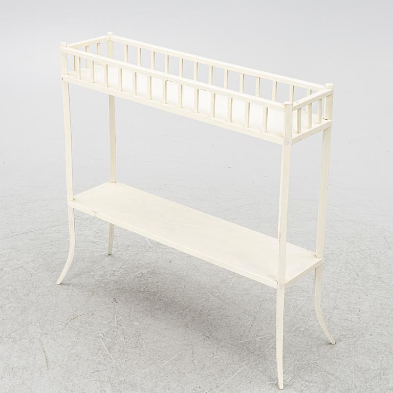 A plant stand, circa 1900.