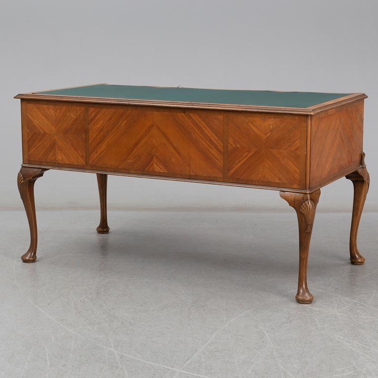 A Rococo-style circa 1900 writing desk.